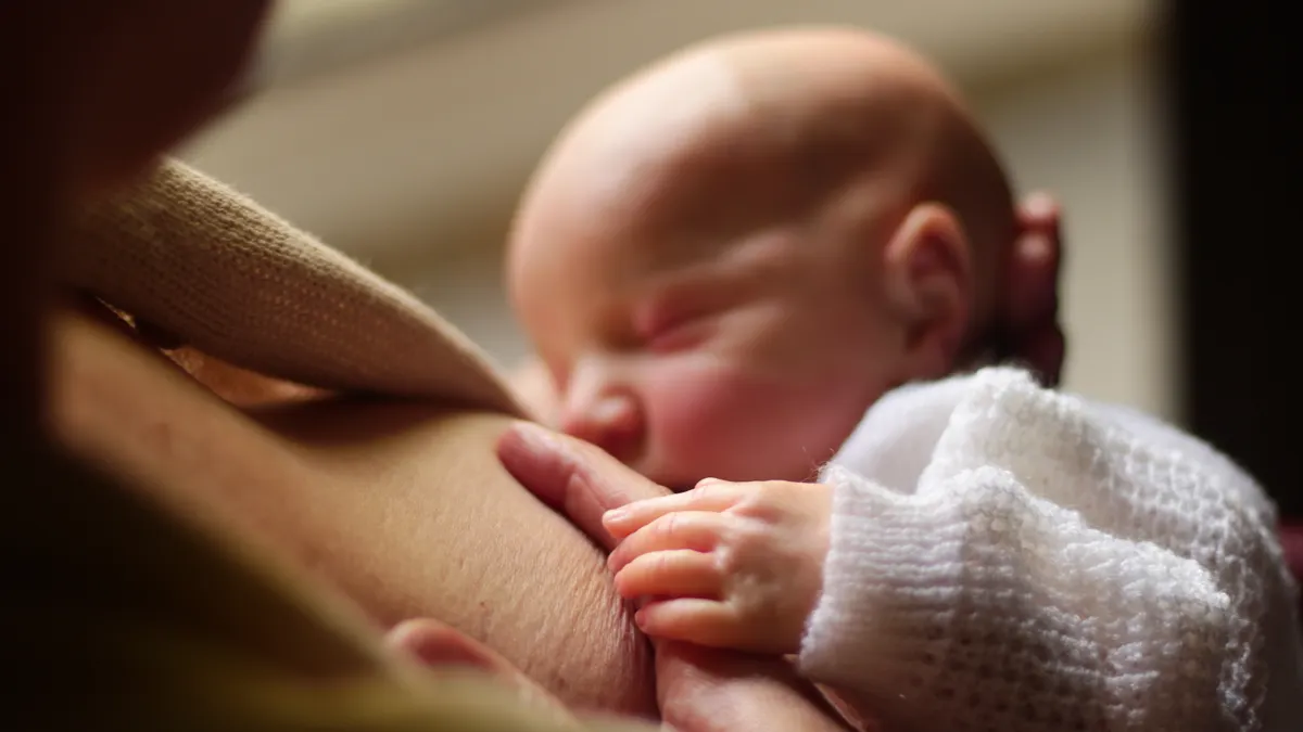 Breastfeeding basics for newborns: what to expect in the first week Close-up of baby nursing at breast
