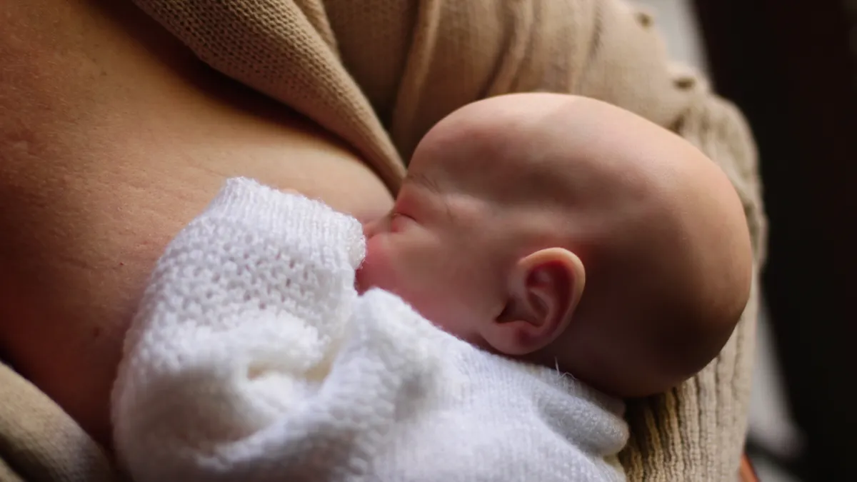 Close-up of a newborn nursing