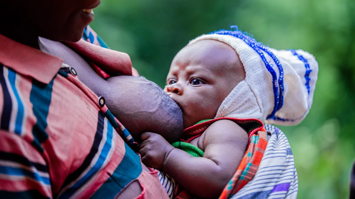 Close-up of a baby breastfeeding